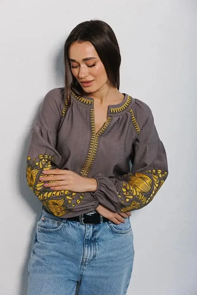 Women's embroidered blouse in graphite color with smooth floral patterns on the sleeves