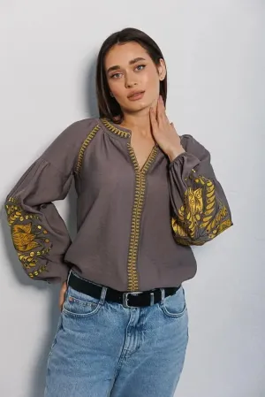 Women's embroidered blouse in graphite color with smooth floral patterns on the sleeves