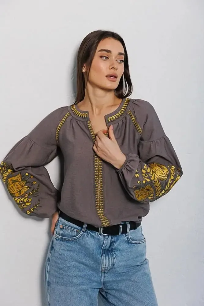 Women's embroidered blouse in graphite color with smooth floral patterns on the sleeves